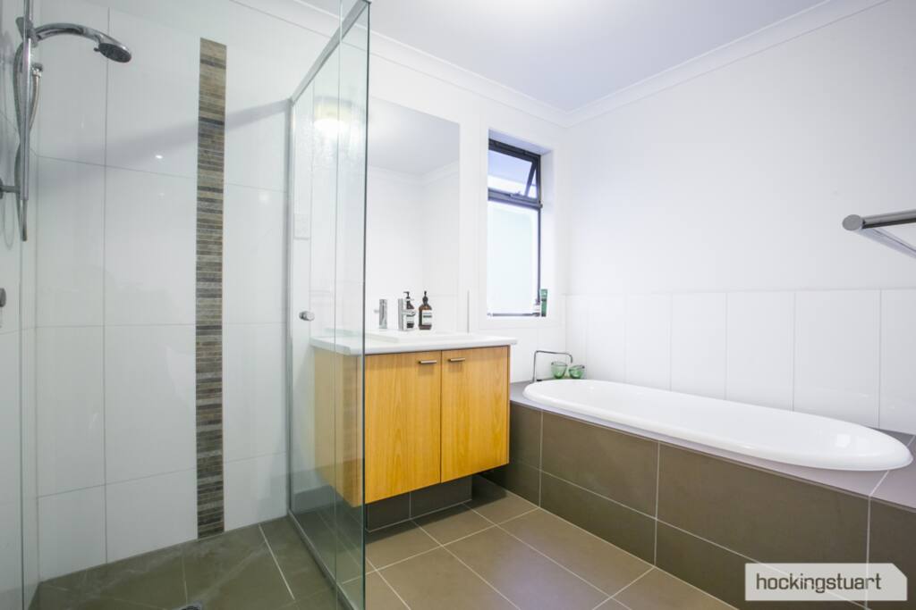 Main bathroom upstairs (features spacious bath and shower)