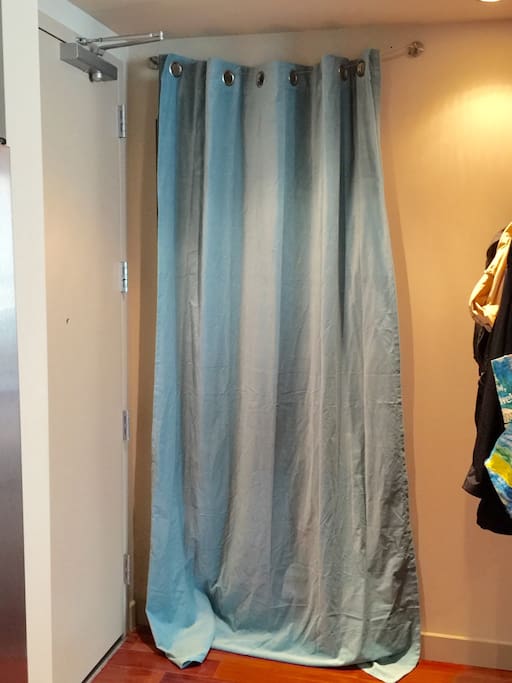 Private den entry with a double-layered curtain.