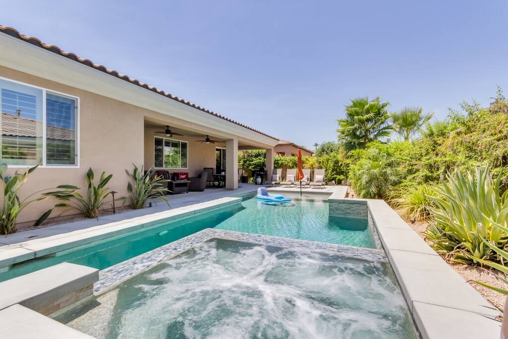 Eight person spa, saltwater pool with large tanning area and two wall waterfalls
