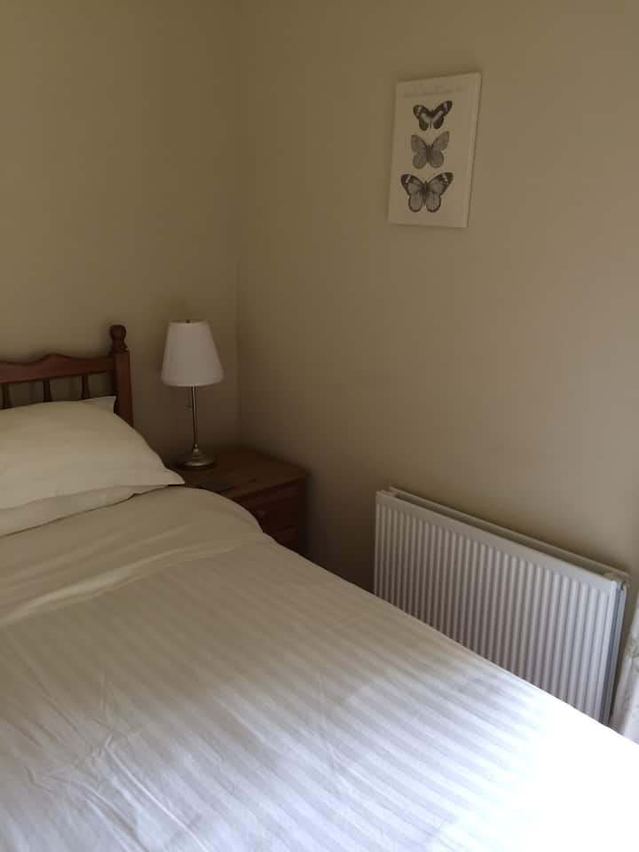 A comfortable kingsize bed in bedroom 1 