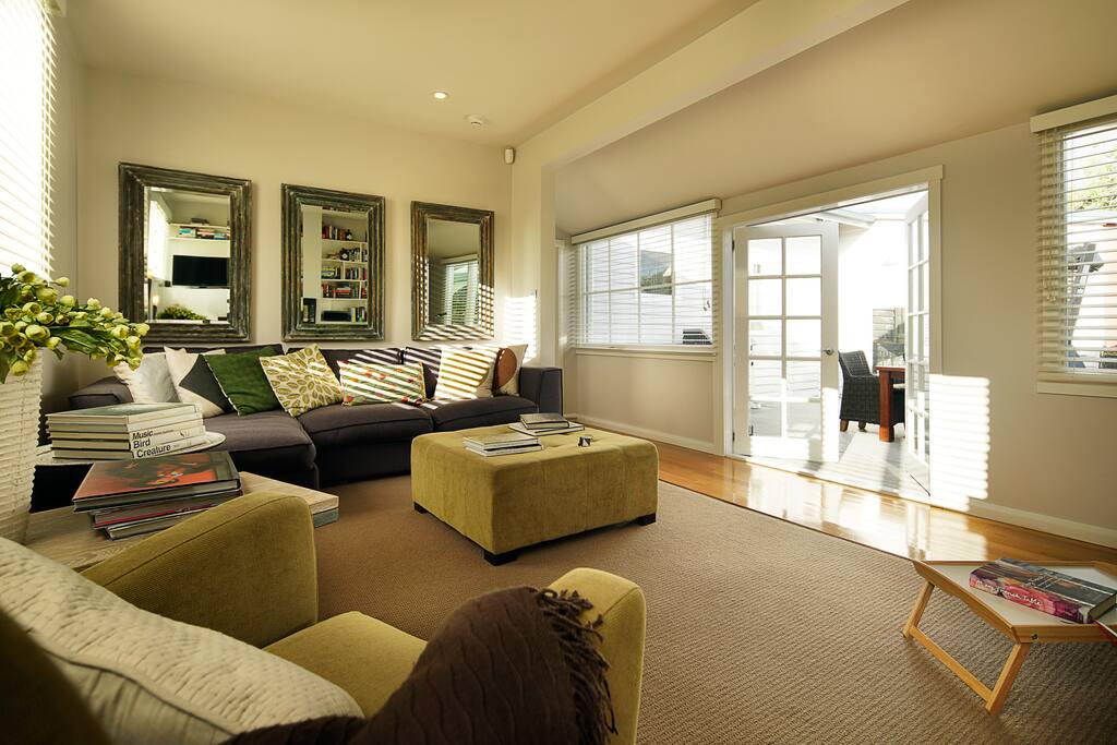 French doors lead onto the deck area and into a large secured backyard.