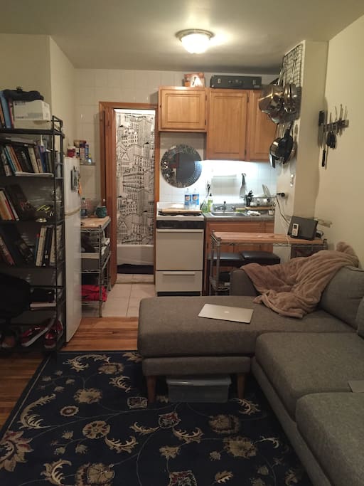 Opposite view is of kitchen and bathroom entrance.