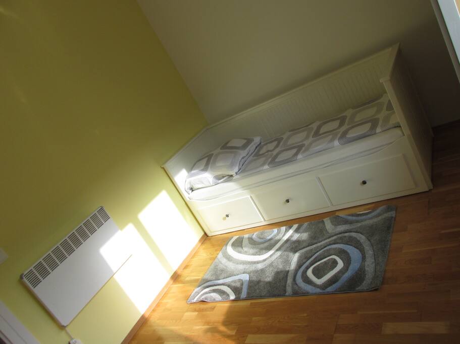 Main room with the recently painted yellow wall