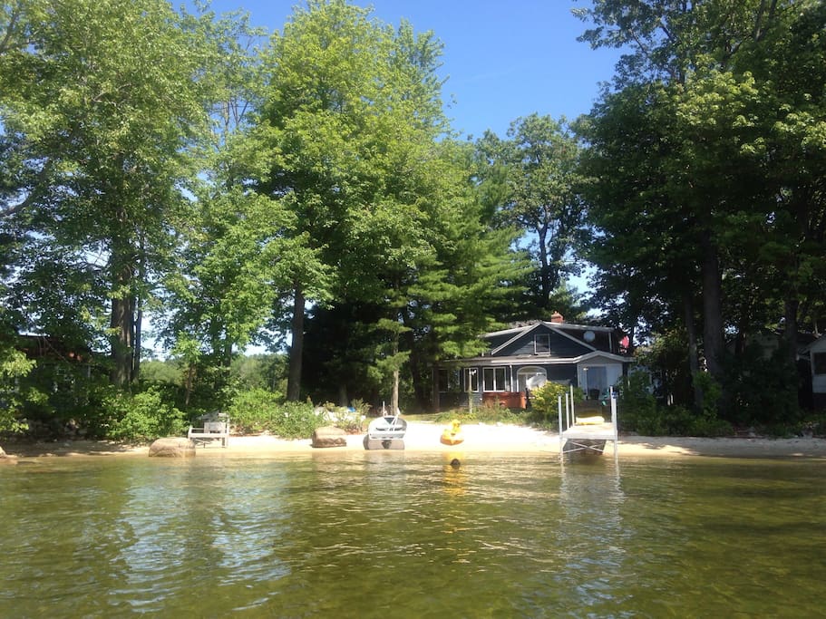 View of the house from the lake. Great beach with shallow entry.