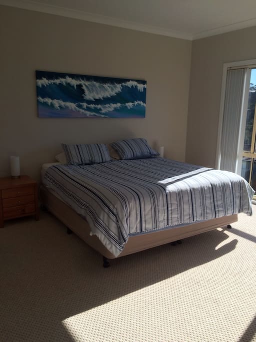 Main bedroom with ocean views, walk- in wardrobe and ensuite