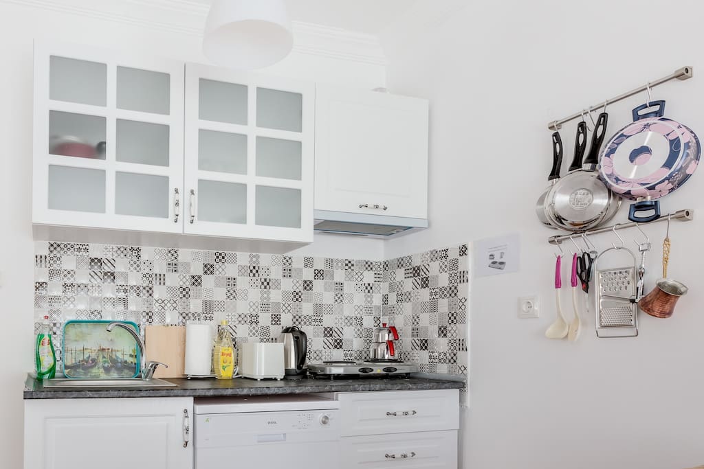 The fully equipped kitchen; dishwasher, cooker, toaster, kettle, pots and pans and silverware. You can see refrigerator and microwave oven on other pictures
