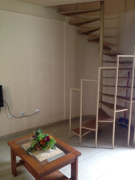 Stairs to the room on the upper level of the unit