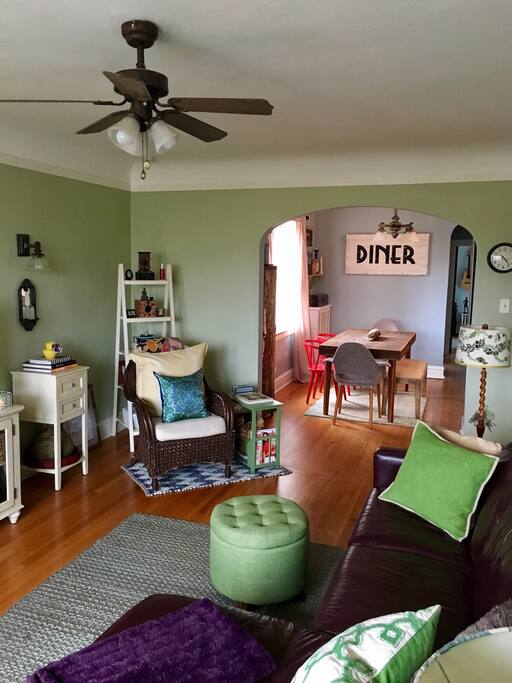 Spacious living room and reading area open to the dining area.