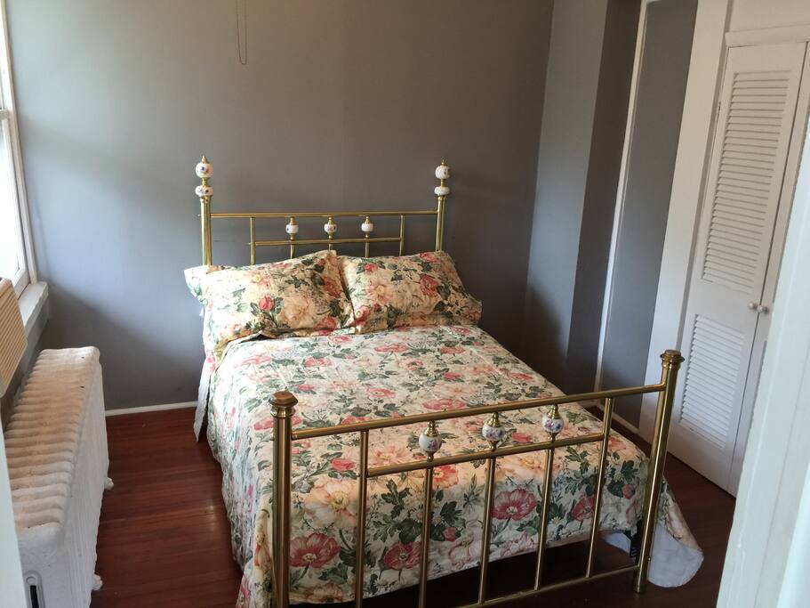 Brass bed, with full-sized mattress, and box spring. Large, lighted closet to the left.