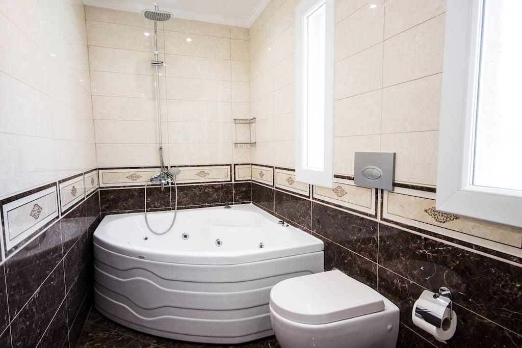 Private bathroom with Jacuzzi inside, in the master bedroom.