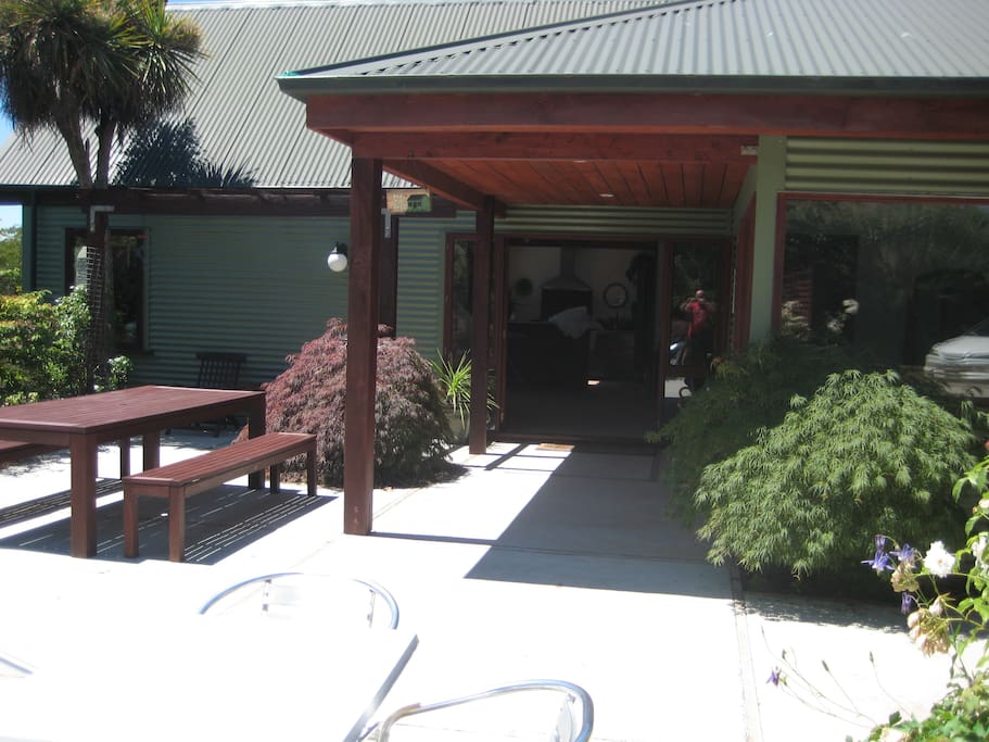you access the ensuite room from this patio, and all guests are welcome to use