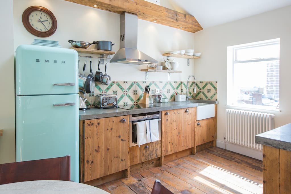 Fully equipped kitchen with Smeg fridge/freezer, washer/dryer, combination microwave/oven and electric hob.