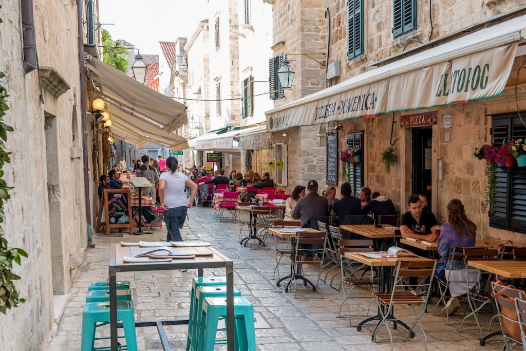 Located in Domino street, numerous restaurants among ancient traditional stone houses...