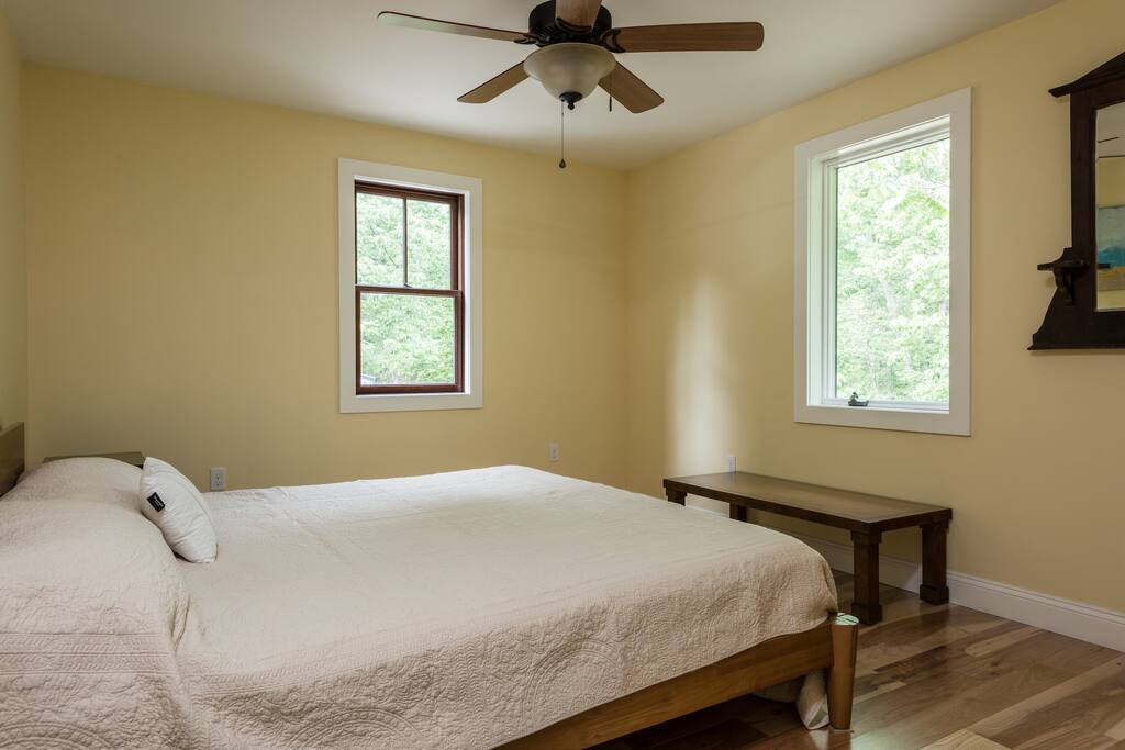 Master bedroom with King Size platform bed with Casper Mattress. Large closet with hangers and clothing storage