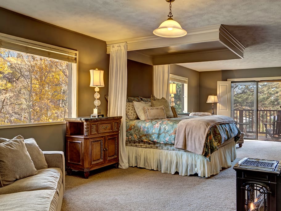 View out to private master suite with balcony overlooking creek