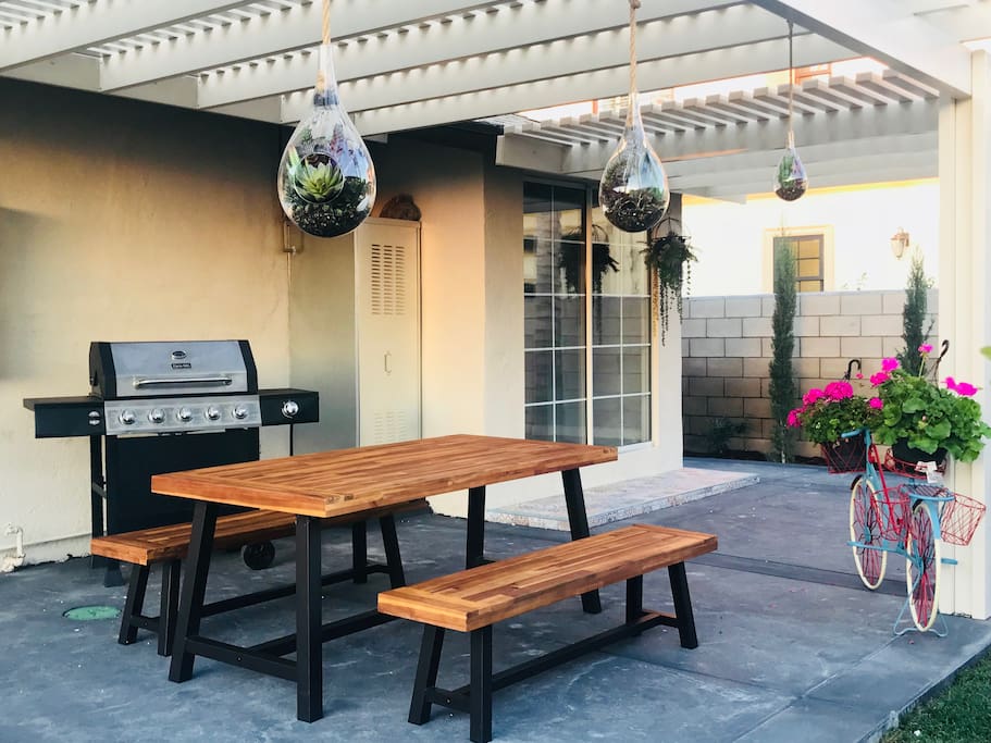 Private backyard with seating and BBQ