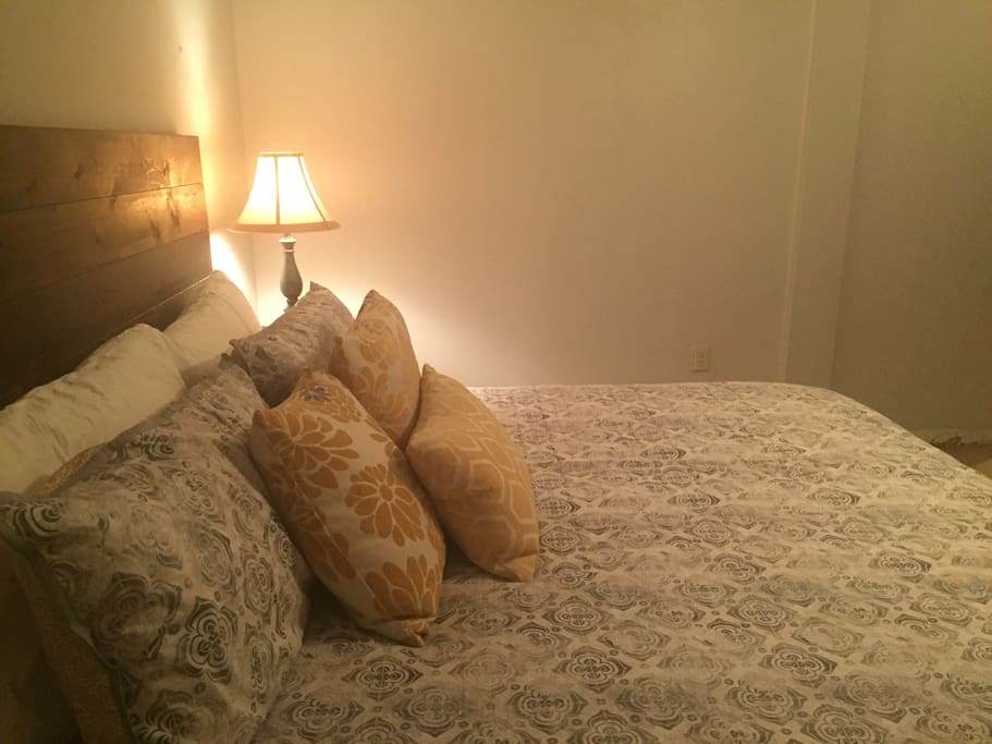 King size bed in private bedroom on lower level