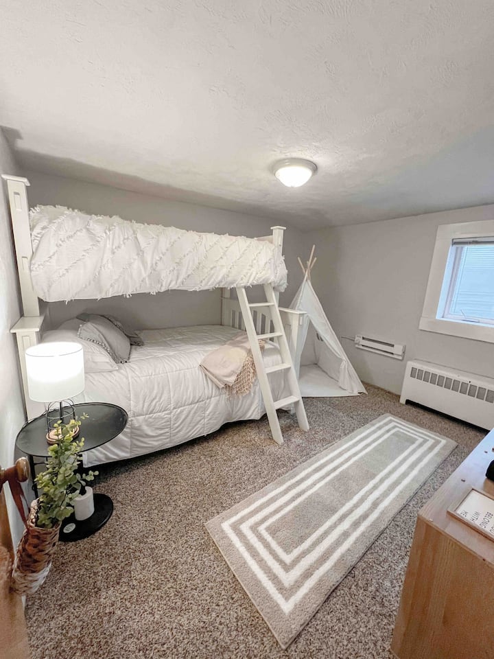 Our “ Kids room” has a bunk bed with a twin mattress above, a full mattress below and a pull out trundle twin mattress. The teepee is perfect for kiddos excited to play. A Bluetooth speaker is included for any spontaneous need to jam out. 