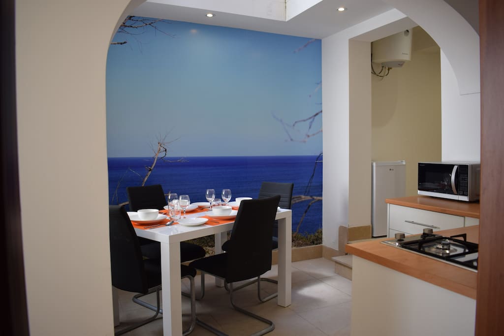 An inviting Maltese sea view (poster) tempts one, as you come out of the living room