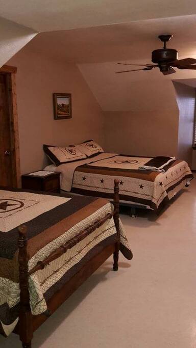 Upstairs Bedroom. 1 full size bed and 1 king size bed