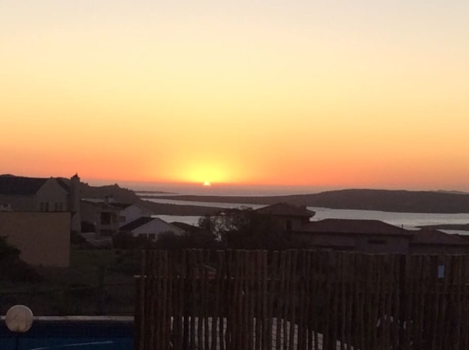 Sunset from behind the fire pit and pool
