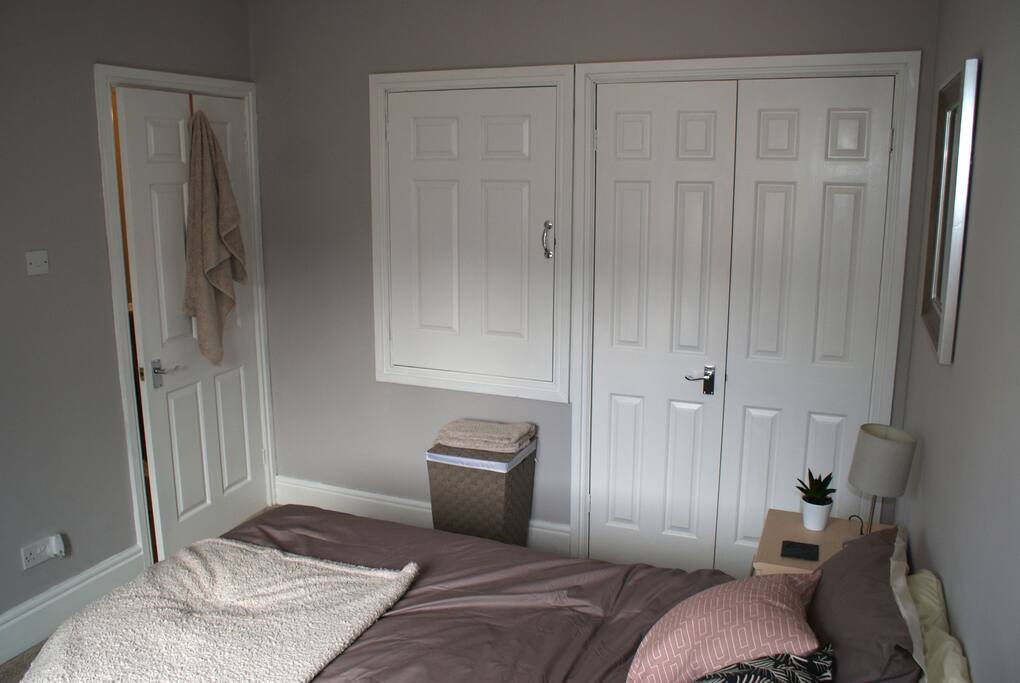 Hang your clothes in the built in wardrobe.