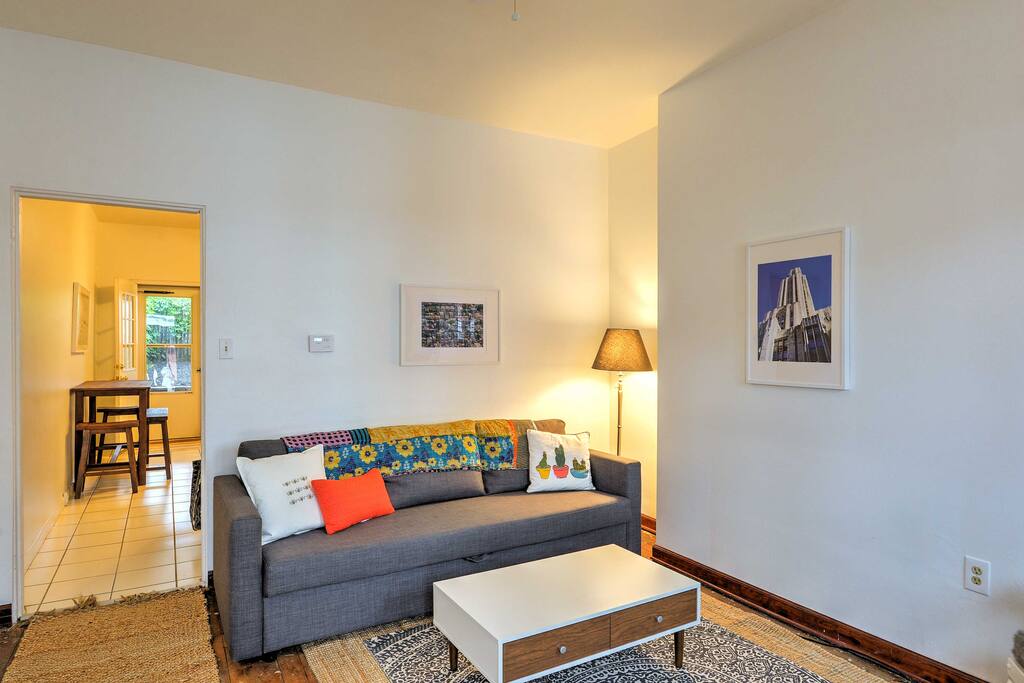 The home's cozy interior features simplistic decor and comfortable furnishings.