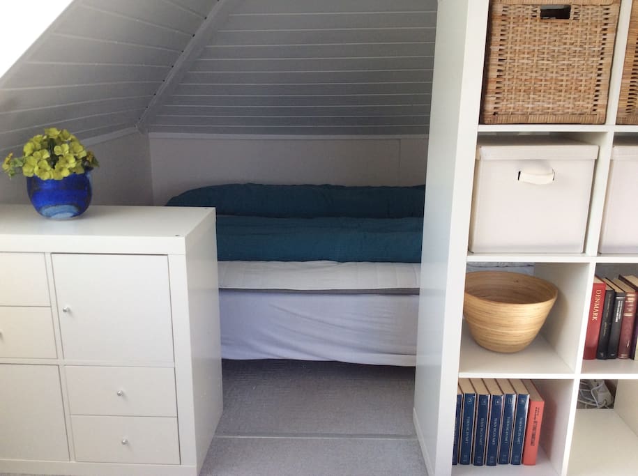 Secluded alcove with a queen size bed with room for two.