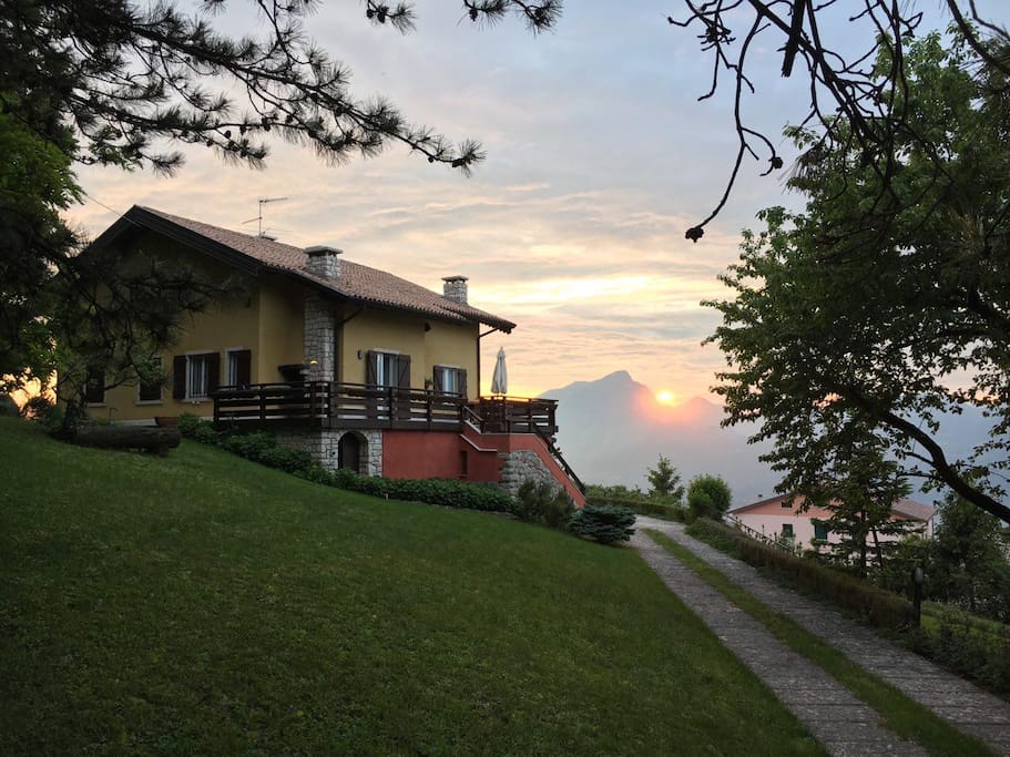 Inspiring Italian villa with private wood and astonishing Garda Lake view.