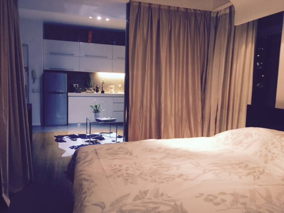 Looking from bedroom to living room/coffee area. Blackout curtains installed throughout house.