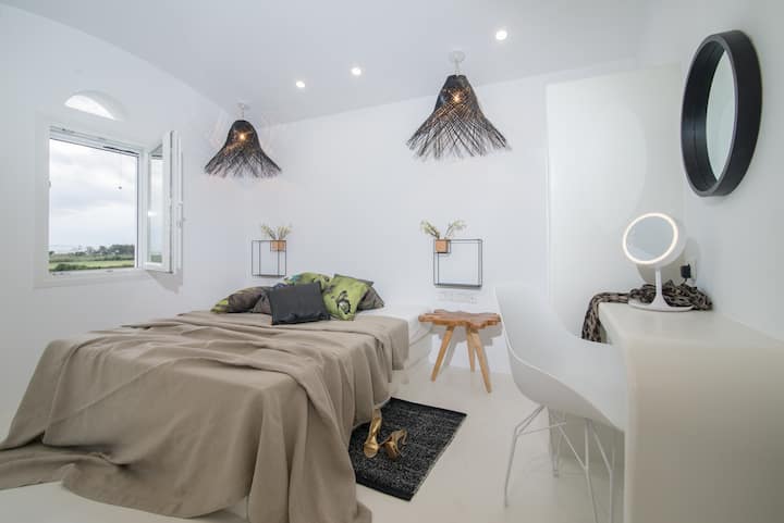 The master bedroom on the top floor offers a great sea view