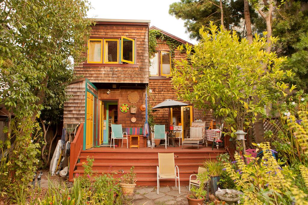 Large deck with lounge chairs, tables, umbrella with great sunset skies.