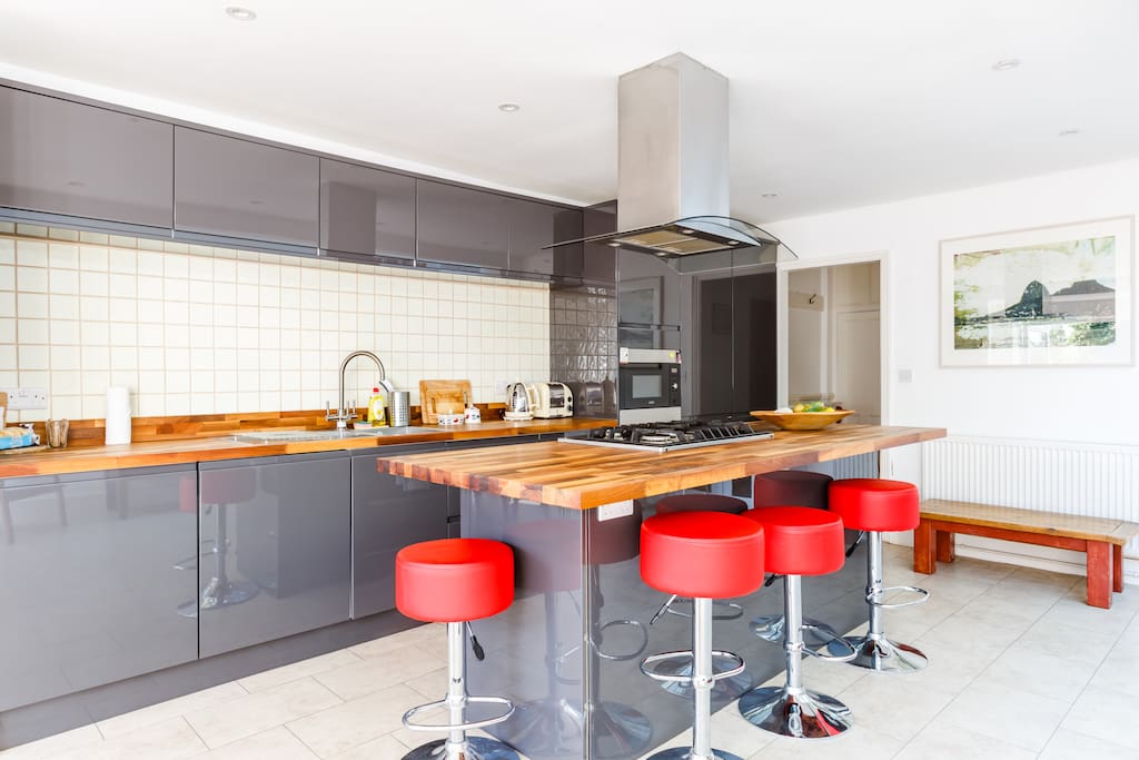 Large light kitchen with cool breakfast bar