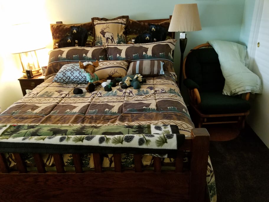 Queen bedroom with moose,bear and deer decor with glider rocker,Bear/Moose theme room