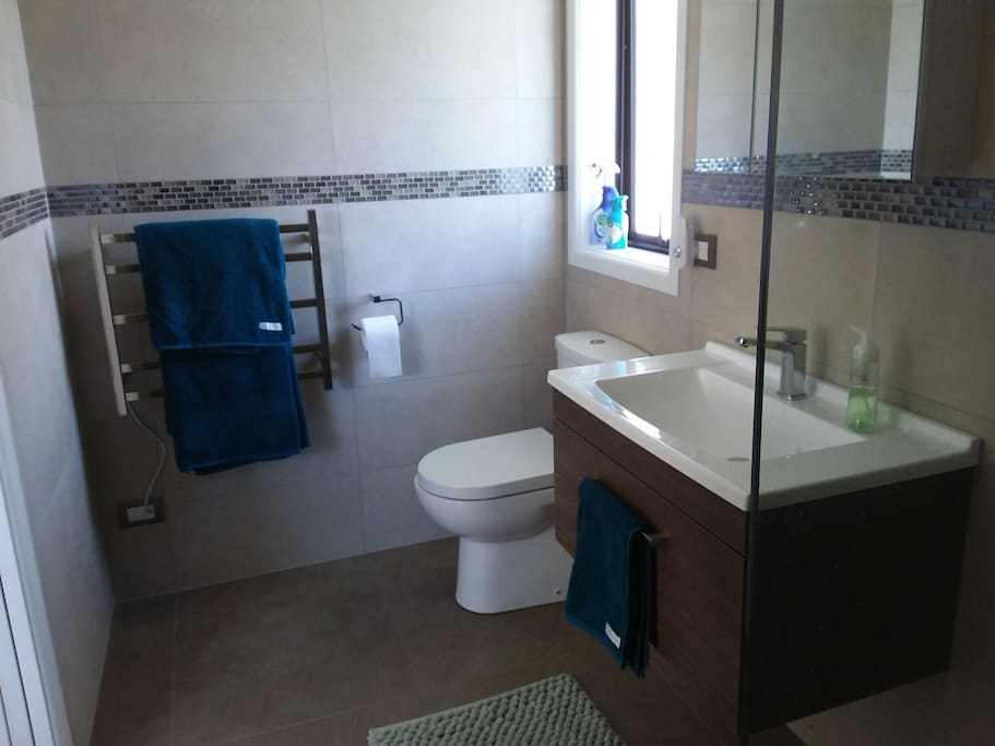 large onsuite with two person shower and heated towel rail. Hairdryer, soap and shampoo supplied.