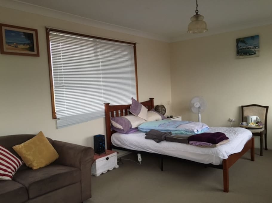 this is your bedroom with sofa, TV & aircon