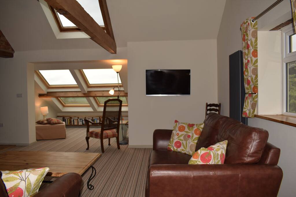 Settle on one of the two sofa's