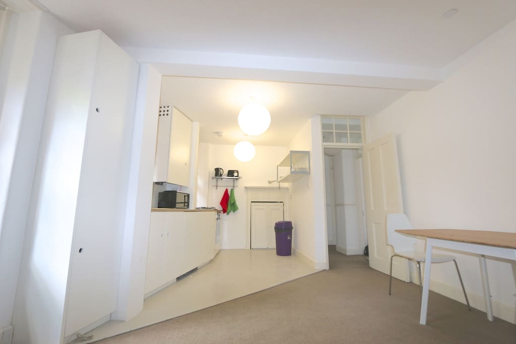 Fully equipped kitchen with fridge/freezer, washing machine, oven and four ring hob.