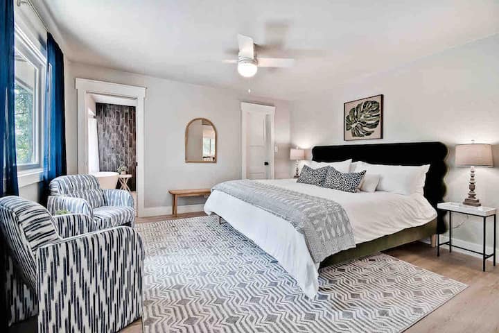 Owner’s suite has a king sized bed with luxurious linens, walk-in closet and lounge area