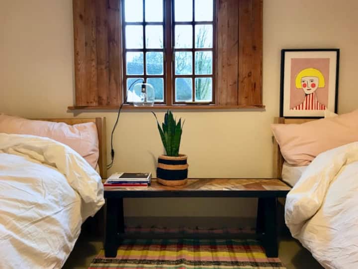 Downstairs bedroom with two singles that can be bolted together to make a double