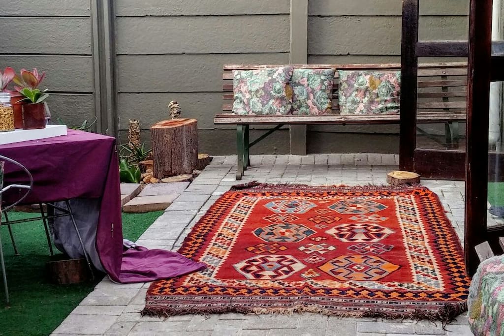 patio. all soft furniture needs to be taken in during evenings. aswell as antique area rug.