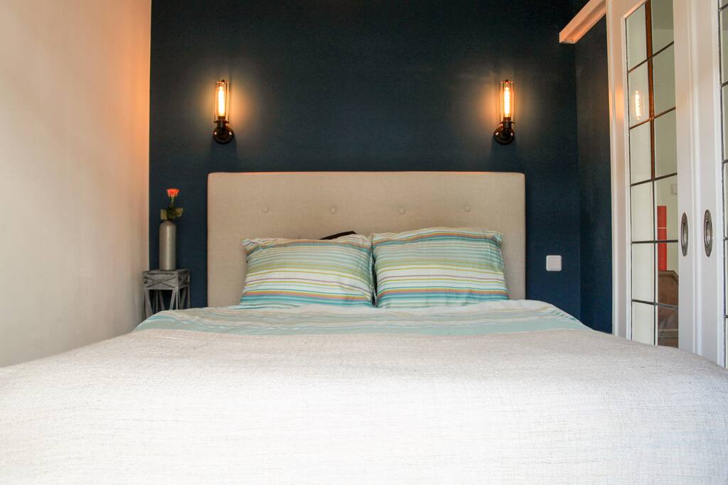 Get to rest in this comfortable bed after a long day of walking through Amsterdam