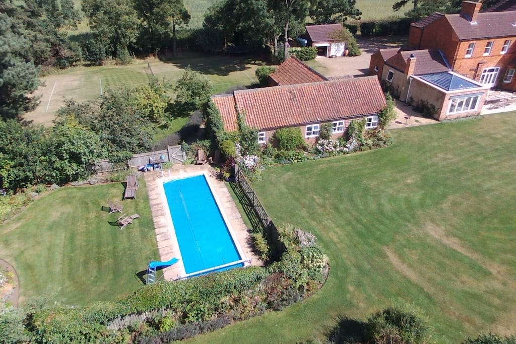 Cottage, pool garden, grass tennis court and main house