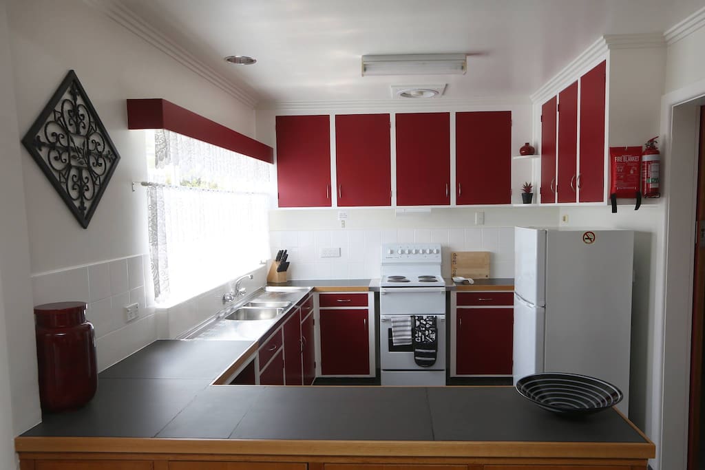 This well equipped kitchen has a large Fridge/Freezer and full sized stove.