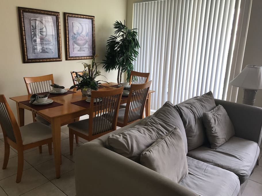 The living area. Pull back the blinds to give access to the balcony.