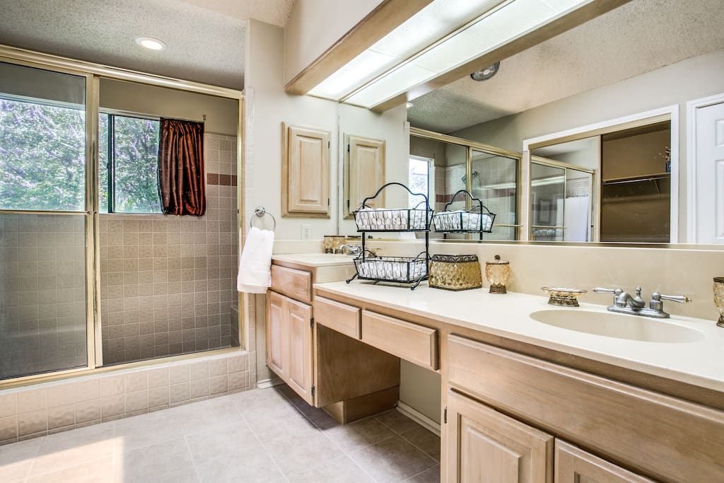Very spacious main bathroom with a large walking closed and huge shower