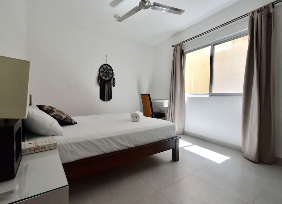 Bedroom with fan and AC