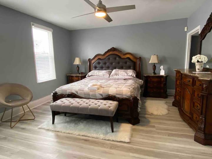 Spread your things out in the large master bedroom with a plush king size bed, large smart TV, and closet with plenty of storage