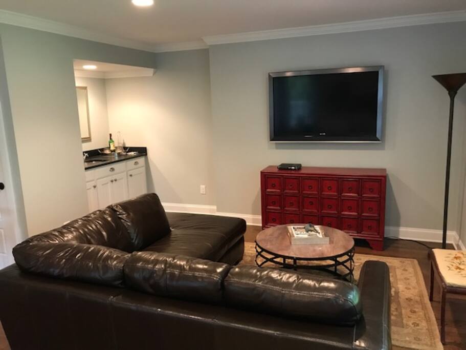 Kitchen opens to living room with wet bar