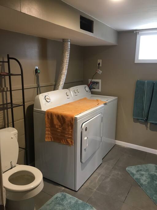 Bathroom is equipped with laundry machines